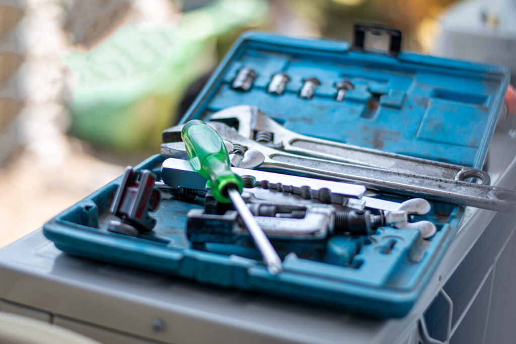 Closeup of the tool consists of screws, spanners, nuts and others in the box of an electrician.